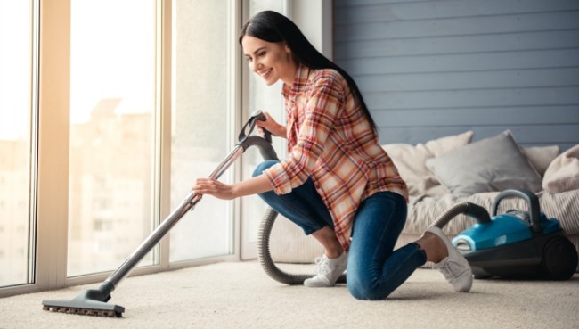 Lady cleaning carpet floor | Cleveland Carpets and Floors