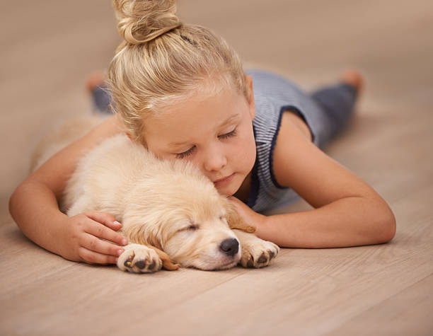 Dog and Girl Lying on Flooring | Cleveland Carpets and Floors